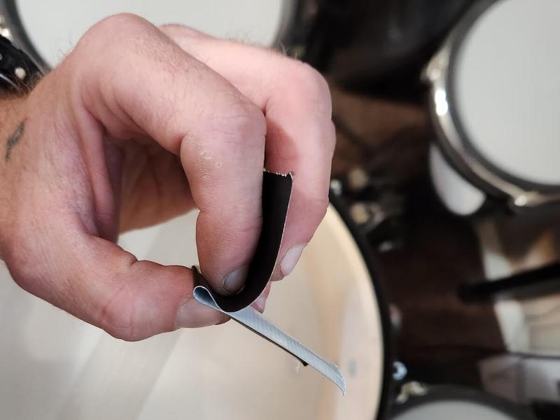 Black tape folded in half to use as a drum dampener